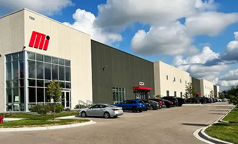 Front of Motion Ai facility building with blue sky in background