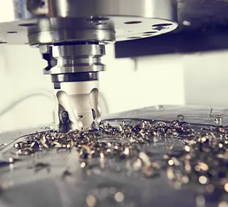 Milling machine cutting into metal