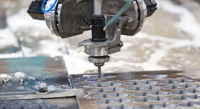 Computer-controlled cutting machine working on a steel plate