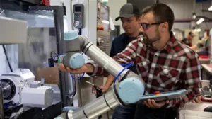 Two men inspecting 3D vision inspection Collaborative Robot (cobot)