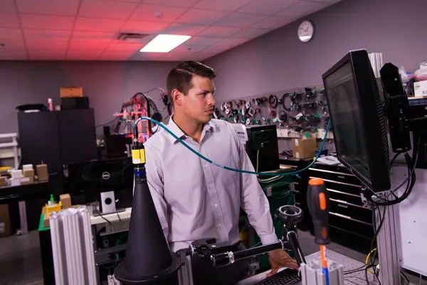 Image of a male machine vision engineer inside a machine vision facility