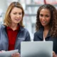 Two women looking at a computer