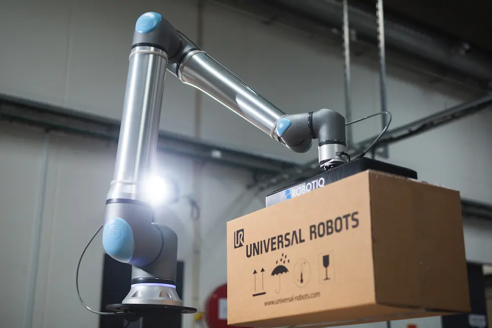 UR20 collaborative robot (cobot) moving packages inside a facility